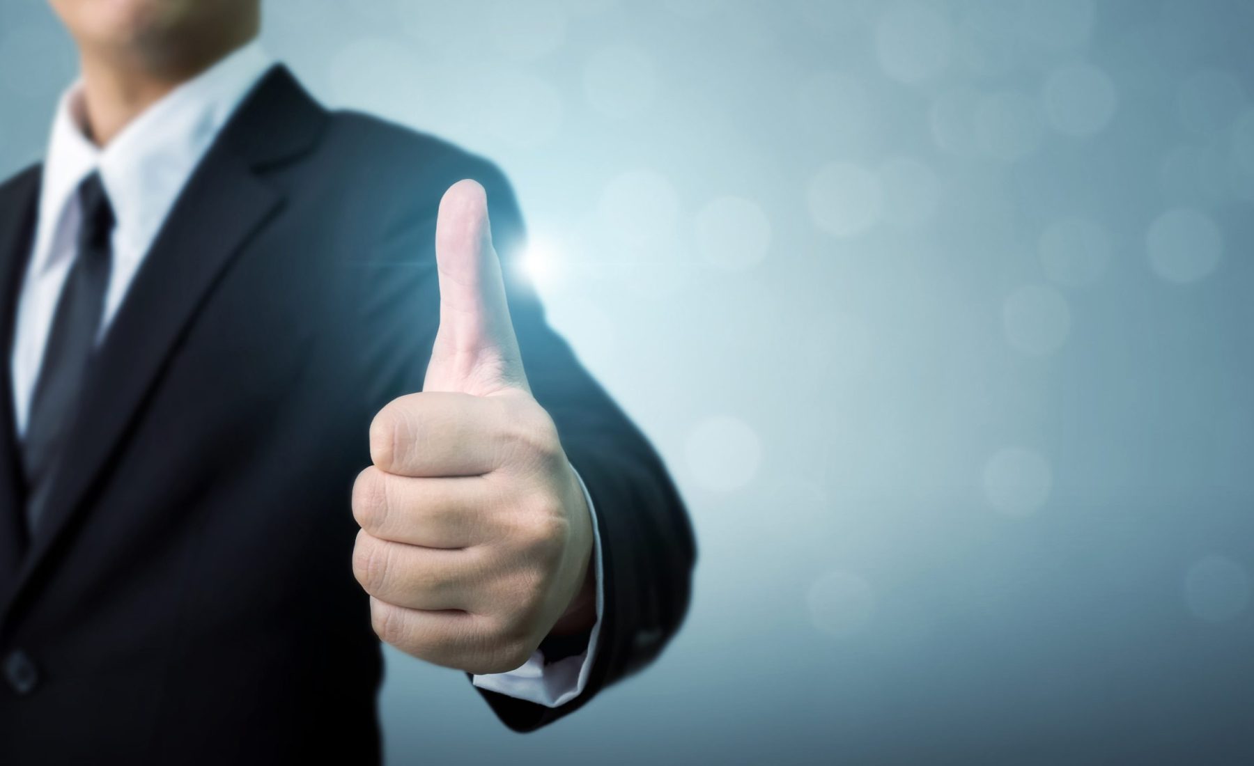 businessman-showing-ok-hand-sign-thumb-up-min